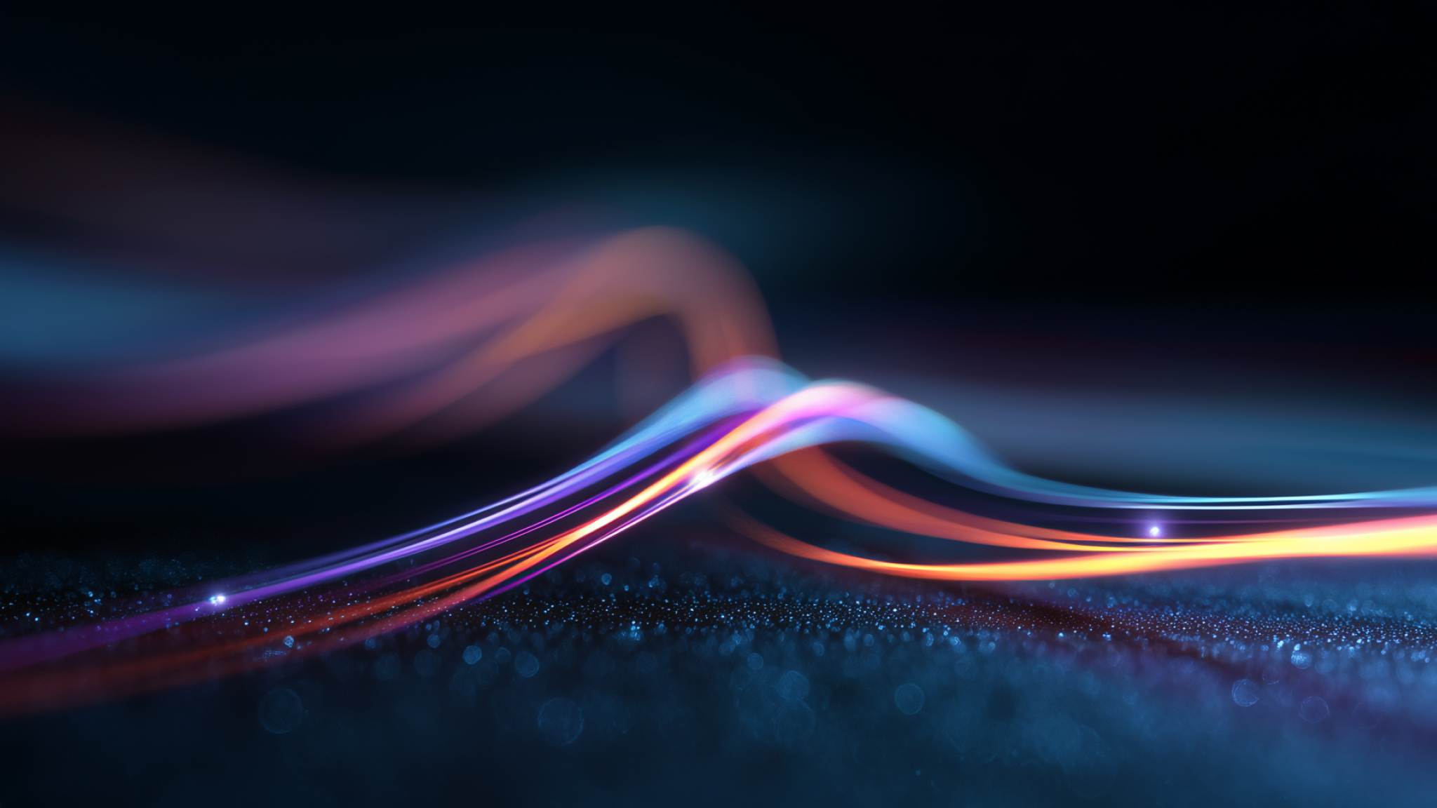 Multi-colored neon fiber lines that signify connection and networking.